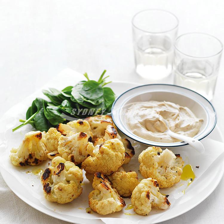 Roasted spiced cauliflower with tahini yoghurt dressing